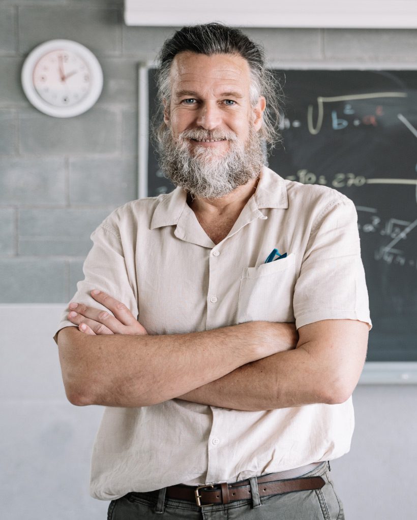 smiling friendly bearded middle aged male teacher UP8H2NK.jpg