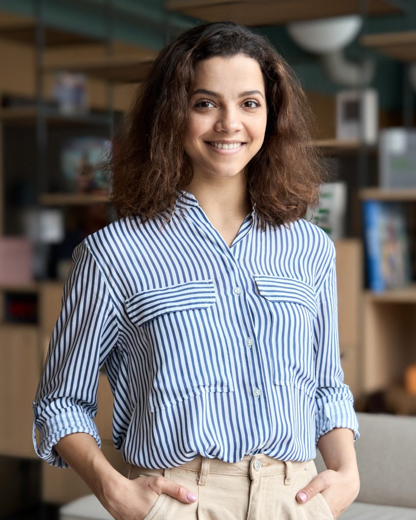 young latin girl student looking at camera standin 9XHKT7A.jpg